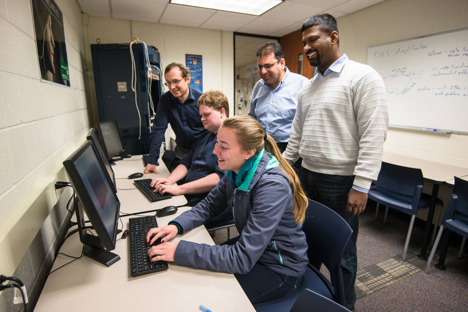 5 people in the Cybersecurity lab